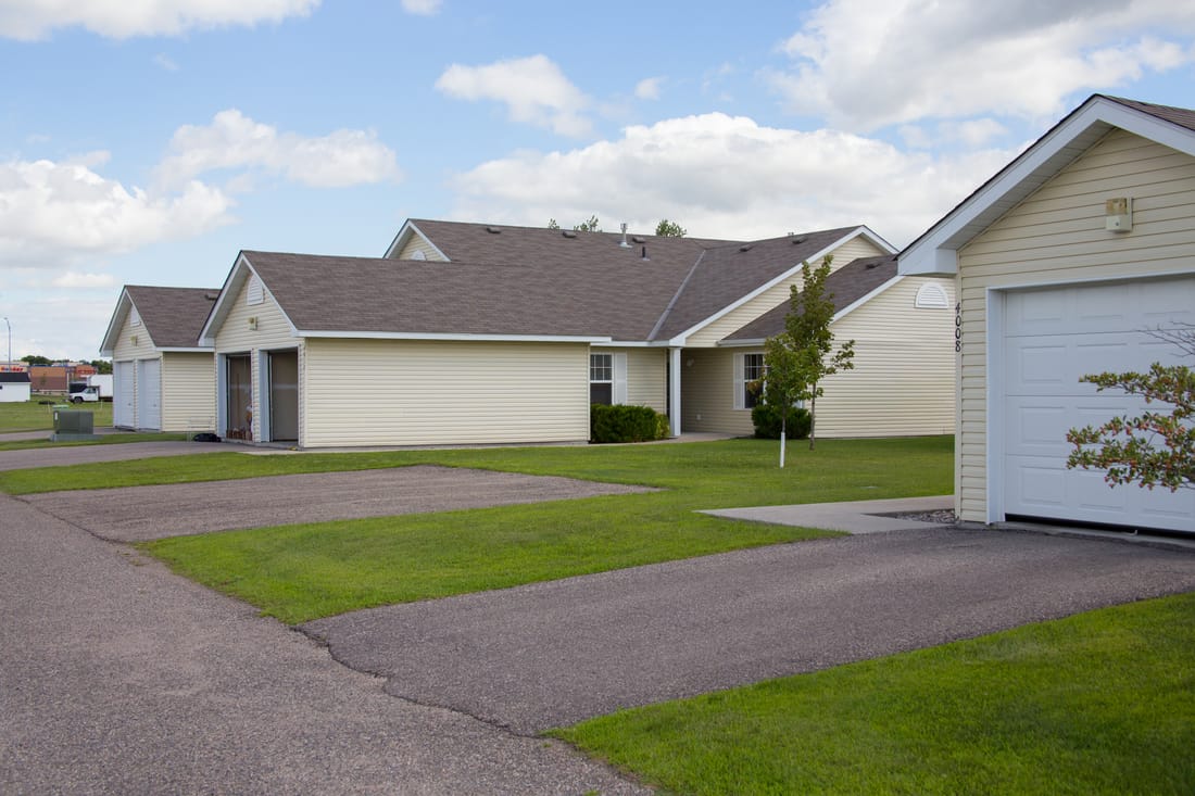 A house with a driveway in front of it.